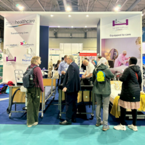 People viewing the Harvest Healthcare bed range at the OT show.